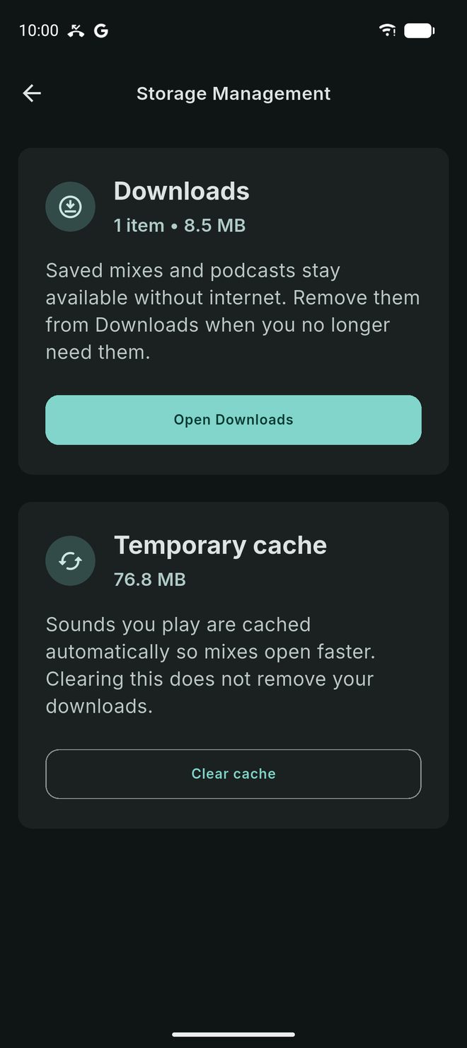The Storage Management screen showing space used by downloads and by the temporary cache, with Open Downloads and Clear cache buttons.